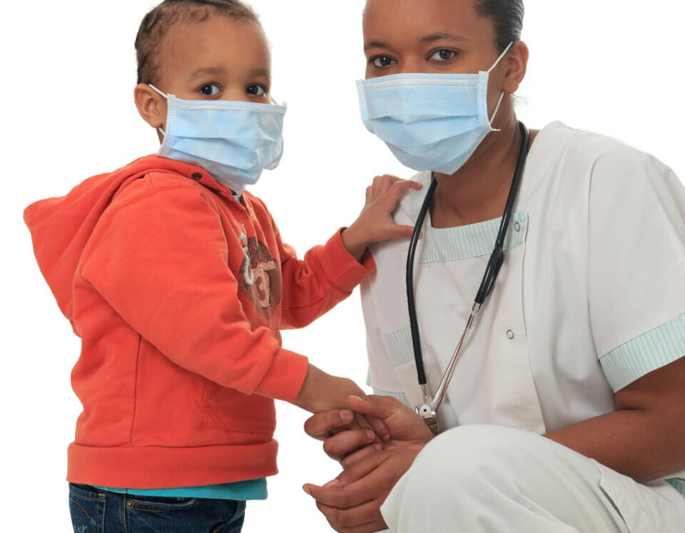child and nurse wearing face mask